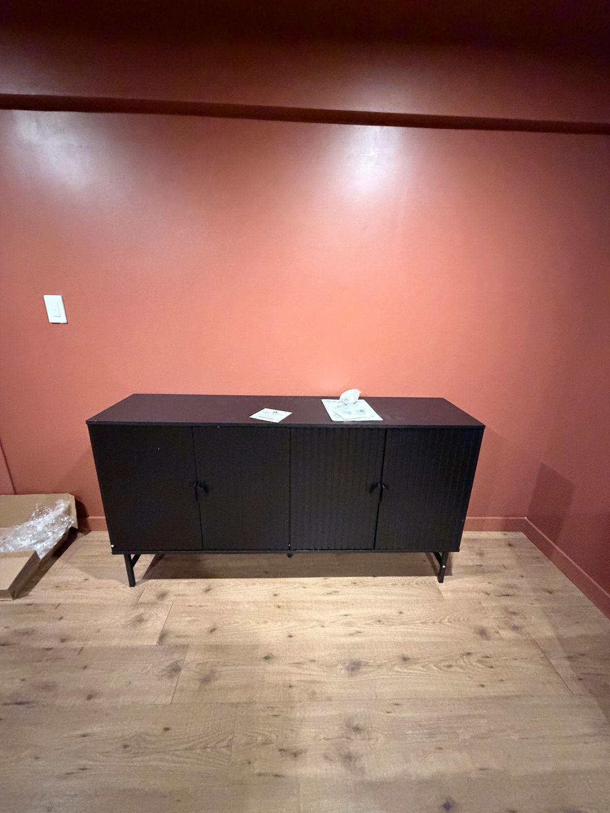 Black Sideboard Assembly Red Wall